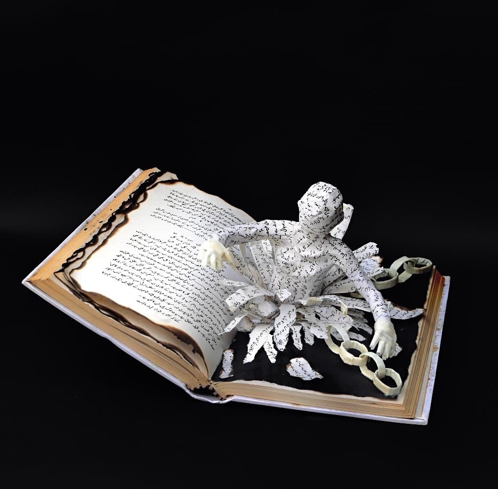 Book pages integrated into sculptural skin